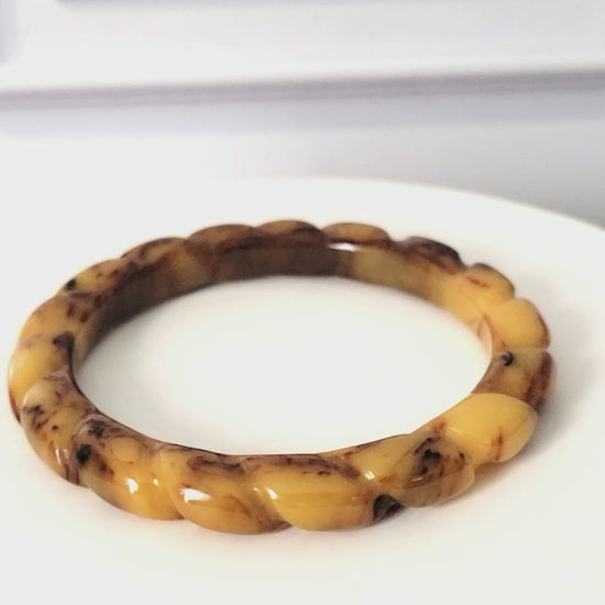 Yellow and brown swirled vintage bangle bracelet.