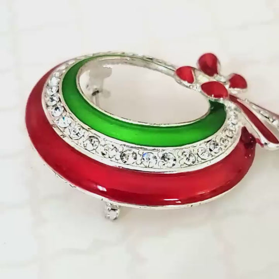 Red and green enamel wreath brooch.