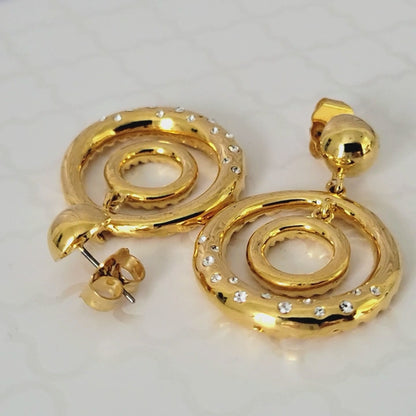 Gold tone double hoop earrings with rhinestones.