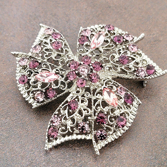 Purple crystal rhinestone brooch.