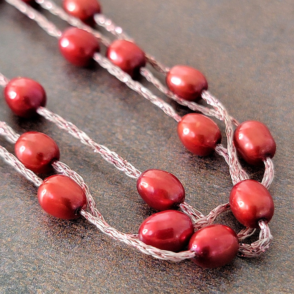 Dyed red pearl beads.