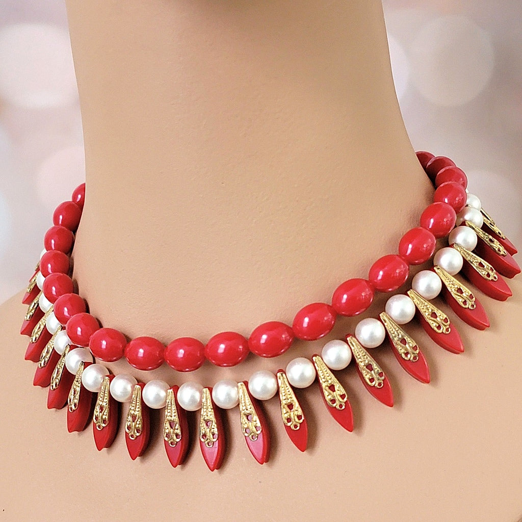 Red beaded statement choker on mannequin.