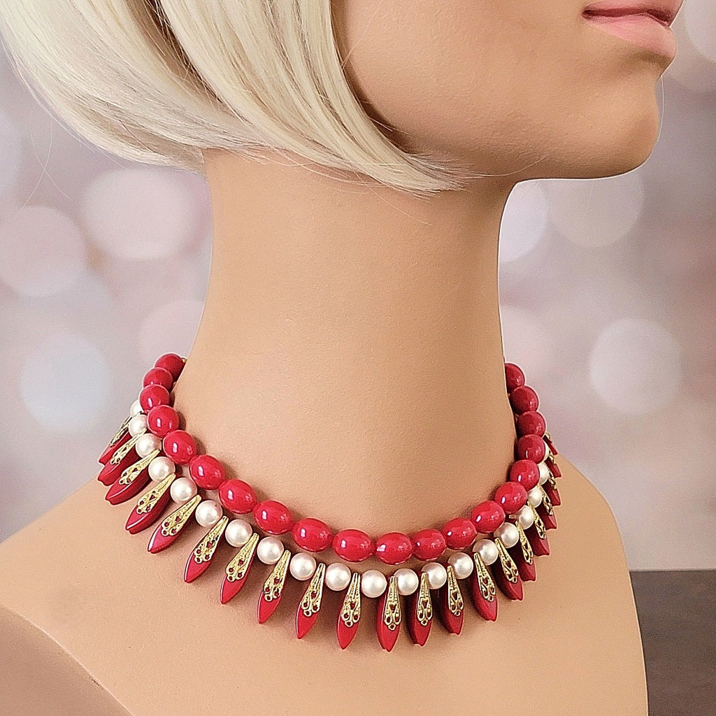 Red vintage spike choker on mannequin.