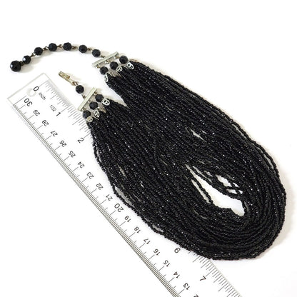 Seed bead necklace with ruler.