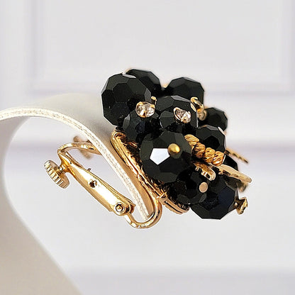 Black glass clip earring.