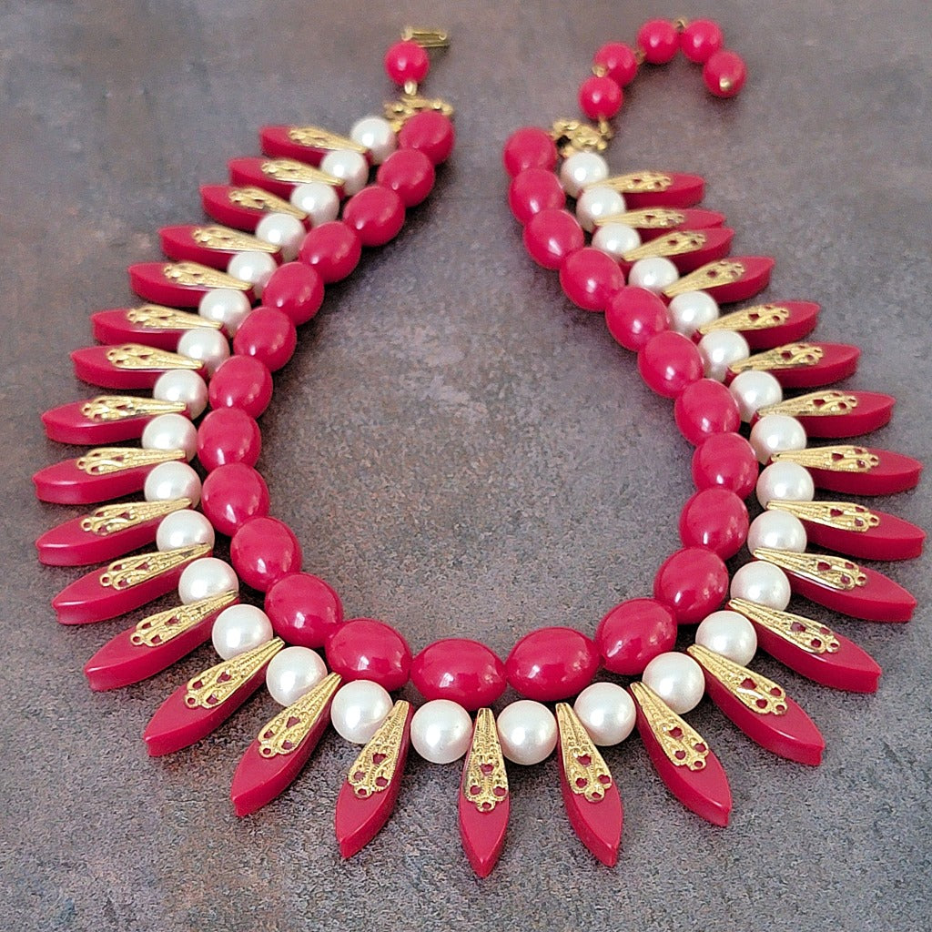 Red plastic spike beaded choker.