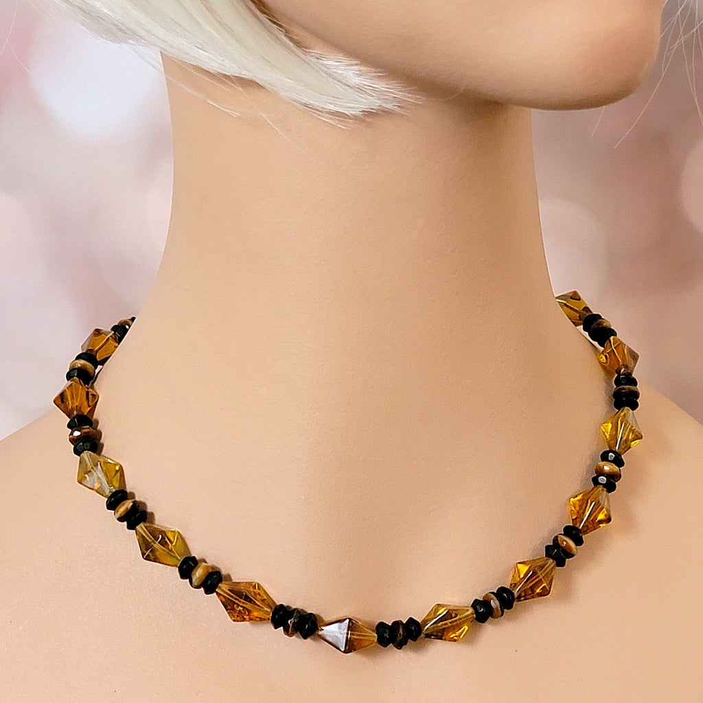 Amber glass necklace on mannequin.