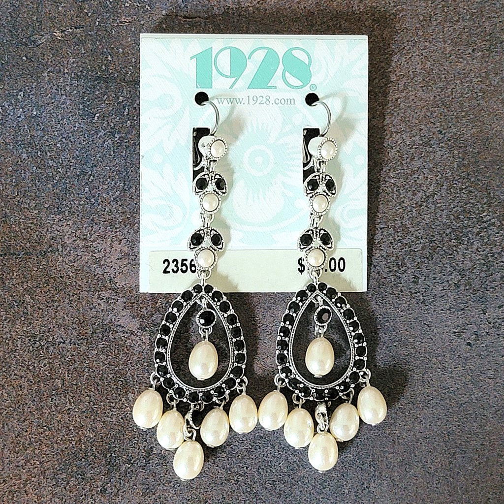 Vintage long faux pearl earrings by 1928, on card.