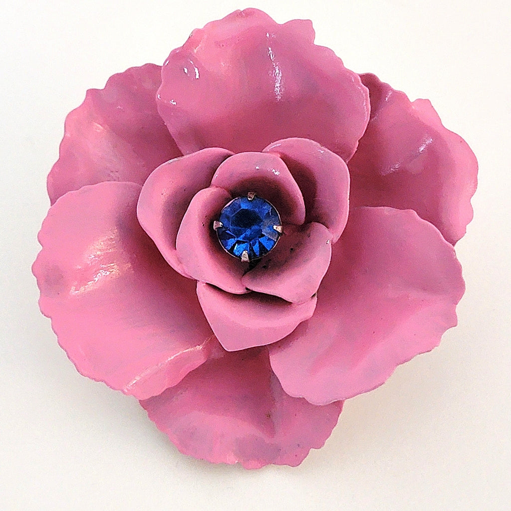 Vintage 60s style pink enamel flower brooch with blue center stone.