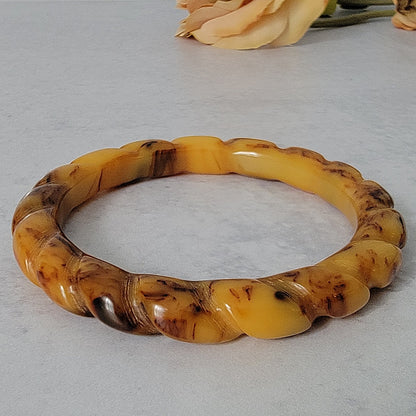 Carved scalloped Bakelite bracelet.