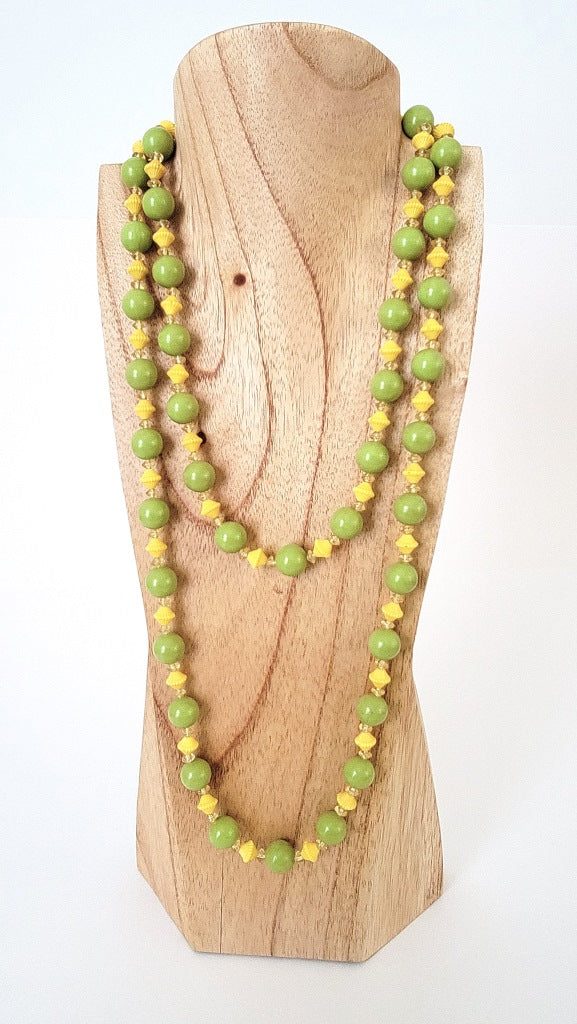 Long green and yellow beaded necklace.