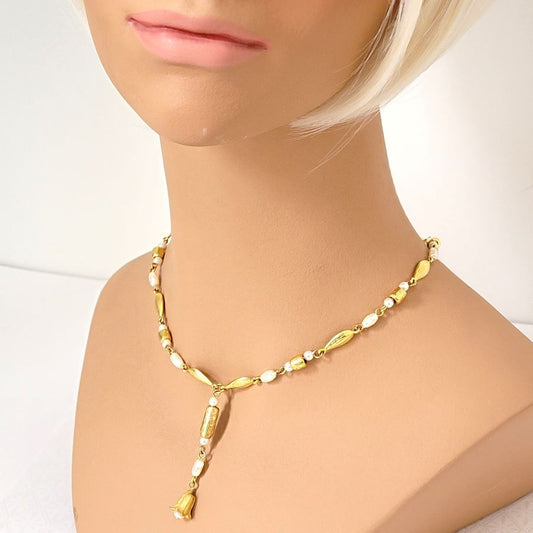 Liz Claiborne faux pearl and gold tone Y style choker, shown on a mannequin.