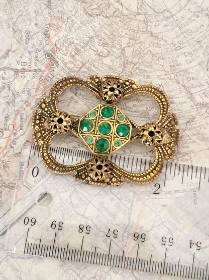 Old World Style Stamped Brass Brooch with Green Rhinestones