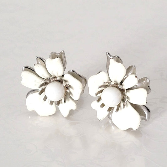 Vintage Sarah Coventry flower earrings with layered white enamel and silver tone petals.